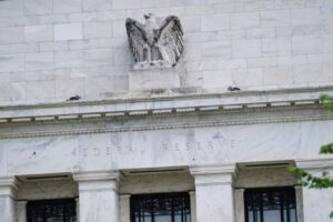 Fed officials stare down market volatility, say inflation remains paramount focus