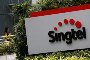 Singtel falls up to 3% after $2.3 billion impairment