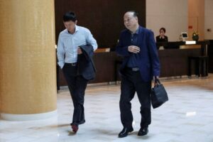 Boss of battery giant CATL visits Elon Musk's hotel in Beijing - Reuters witness