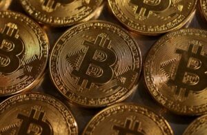 Bitcoin slides below $58,000, rattled by tougher Fed rate outlook