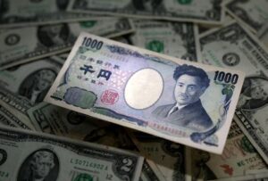 Dollar nears year high after pre-Fed data shock, yen slips