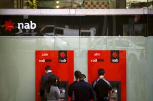 Aussie lender NAB's cash profit falls 13%, to buy back $979 million of shares