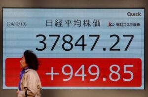 Asia rides Wall St rally, dollar sags on inflation relief