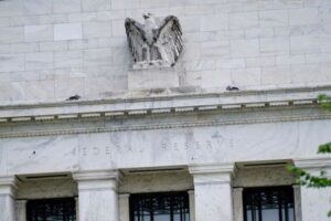 Fed remains cautious on cuts even as data improves