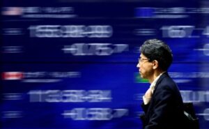 Japanese stocks rise, yen slides after BOJ's cautious stance
