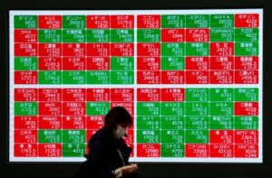 Asian shares mostly higher, yen hits record low versus euro