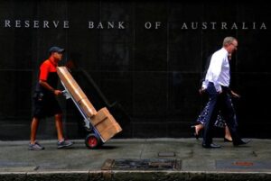 Australia's central bank says policy is restrictive, causing households pain