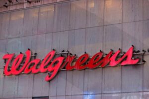 Walgreens cuts profit view, to close up to 700 US stores on spending hit
