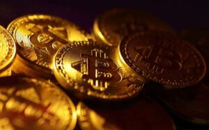 Bitcoin slides to four-month lows, ether sinks 8%