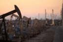 Oil stays near-four month high but Russia export uptick weighs