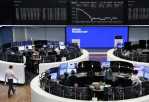 European stocks edge higher as dollar eases, oil prices fall