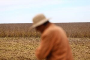 Argentina soy farmers wait on rising prices to sell rain-drenched crop